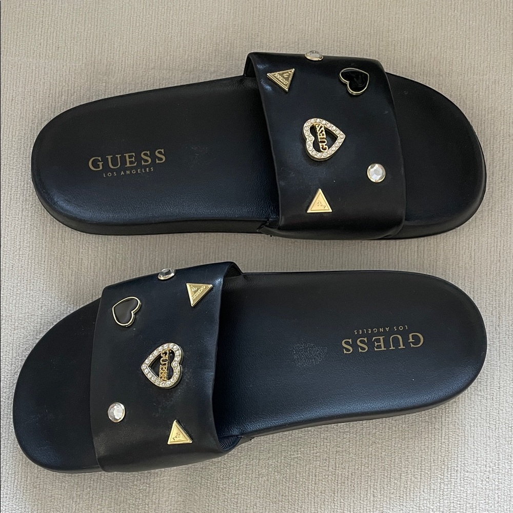 GUESS Black Slide Sandals with Gold & Crystal Heart Accents
